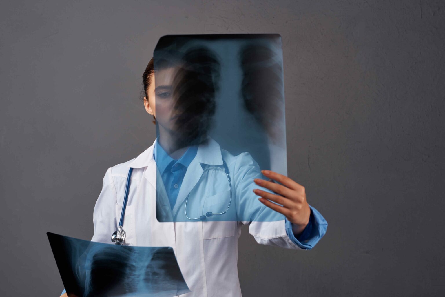 female-doctor-white-coat-medicine-examination-dark-2025-03-10-20-42-32-utc