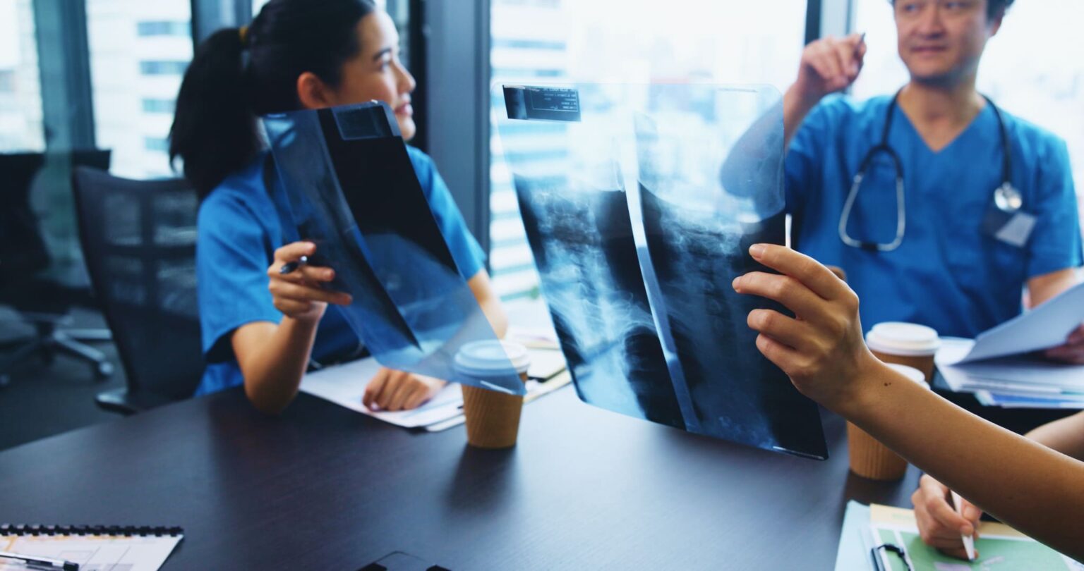 people-nurse-or-medical-team-with-x-ray-in-meetin-2025-04-06-11-30-06-utc